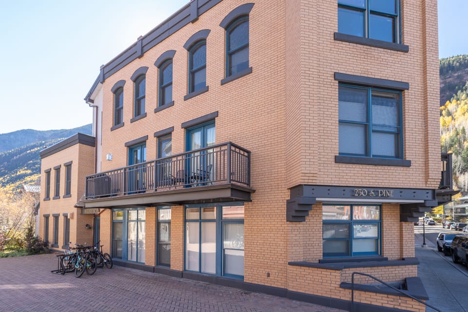 Bike racks and and street door entrance to building.