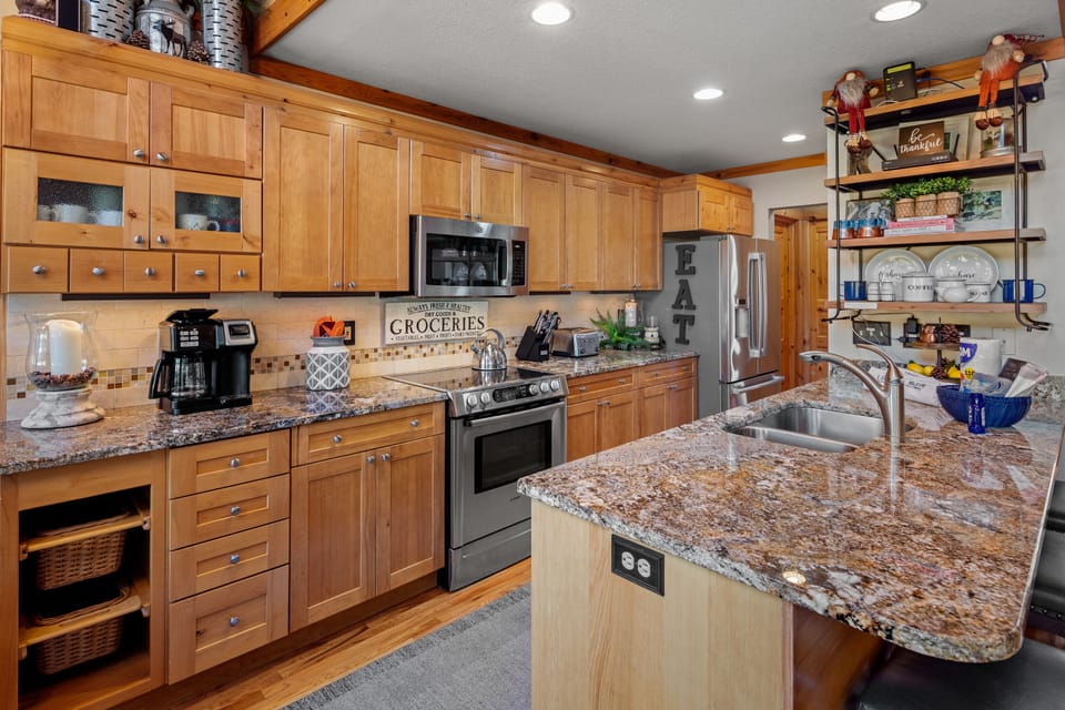 Kitchen with granite countertops and stainless appliances