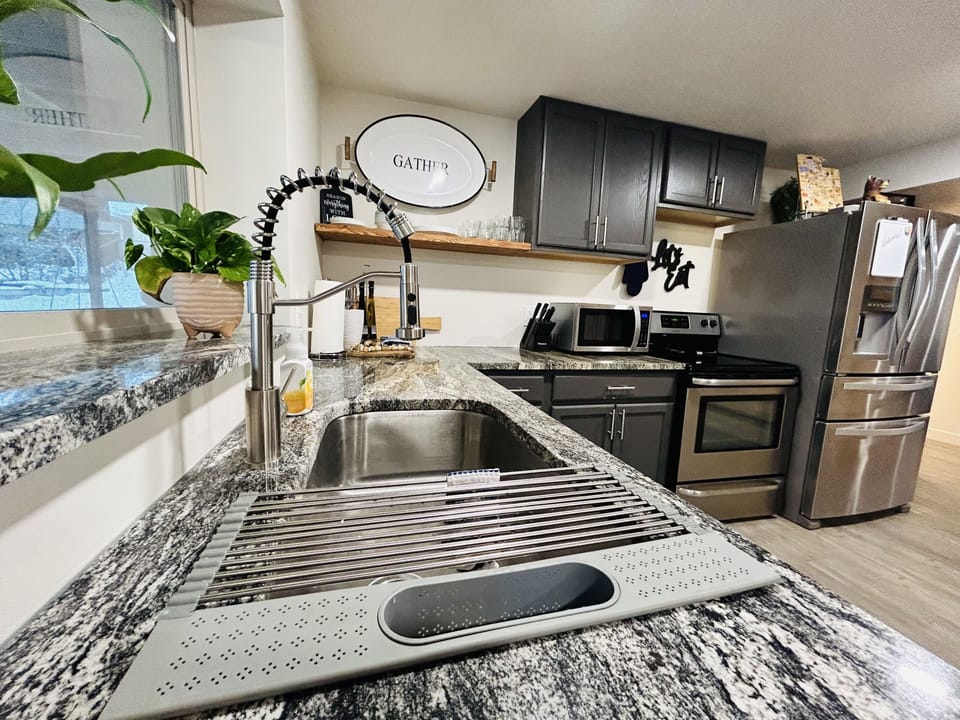 Granite countertops, deep sink, dishwasher, stove. oven. microwave, fridge.