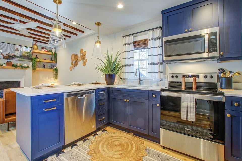 Full kitchen with electric stove, microwave, huge basin sink with garbage disposal, and dishwasher.