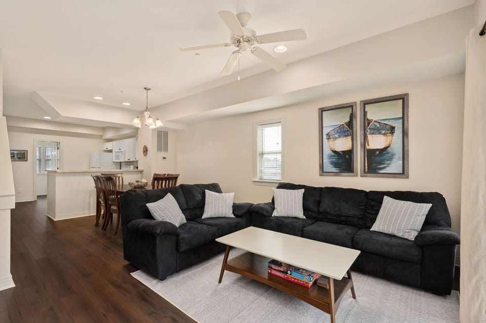 Living room with cards, puzzles, and board games under coffee table