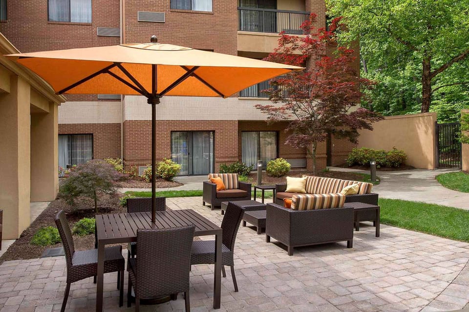 Unwind outdoors on the sunny courtyard patio with seating.