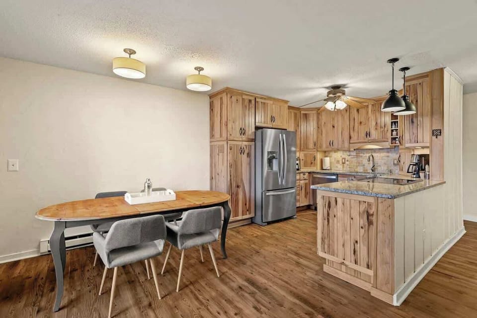 Elevate the dining experience by serving your delicious, homemade meals at the charming wooden table, fostering a cozy and inviting atmosphere.