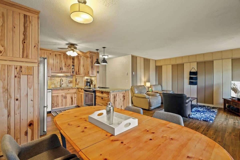 Present your delectable homemade meals on the inviting wooden dining table.