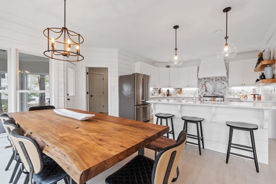 The Handmade solid custom wood table and bench add a touch of rustic charm.