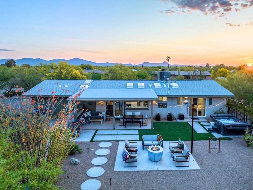 Casa Palma's zen backyard features a hot tub, a fire pit, and Arizona skies.