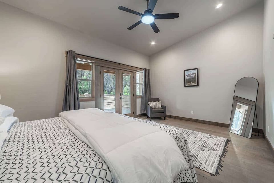 This master suite delivers, says vacation to me. KING size bed. Curl up and rest here!