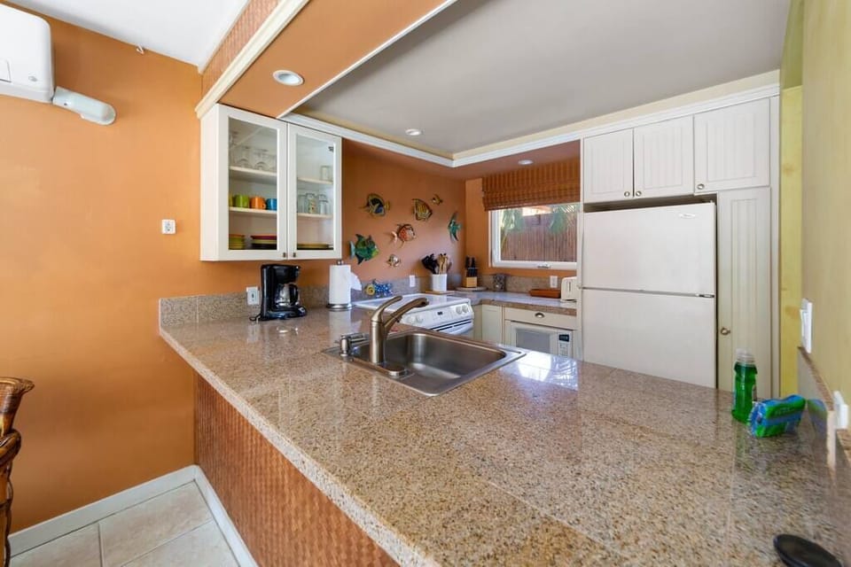 Full kitchen with stove, refrigerator, freezer, microwave