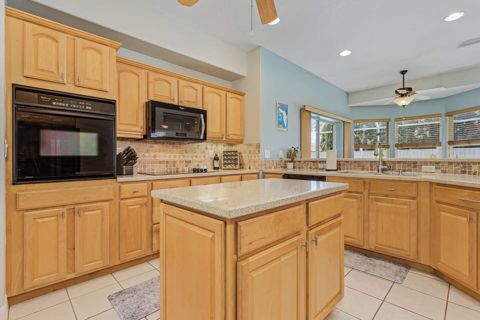 Kitchen features high end knives, toaster oven, pots, pans & blender from Ninja!