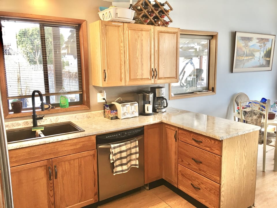 Kitchen is spacious and super well stocked! Open concept to dining & living room