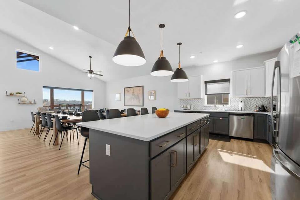 Large kitchen with dual (2) dishwashers and Dining Area that seats twenty-five (25), with two (2) high-chairs for kids.
