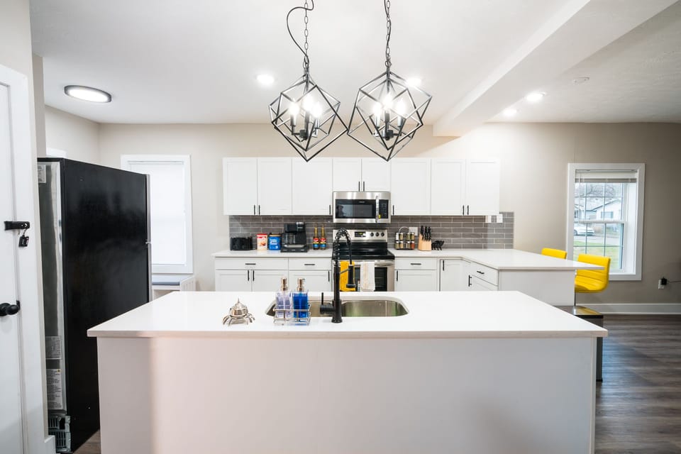 There is plenty of countertop space with the kitchen island.
