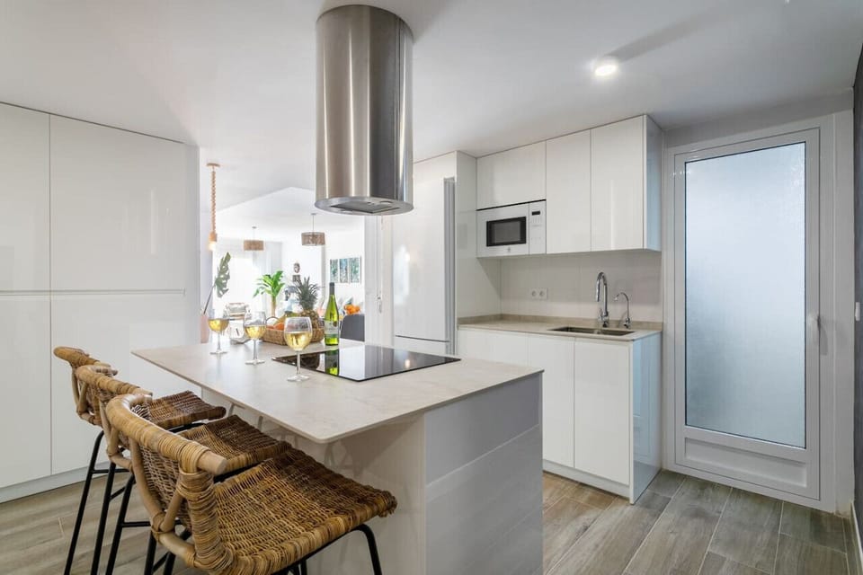 Kitchen has filtered drinking water and access to the gallery that houses the washing machine