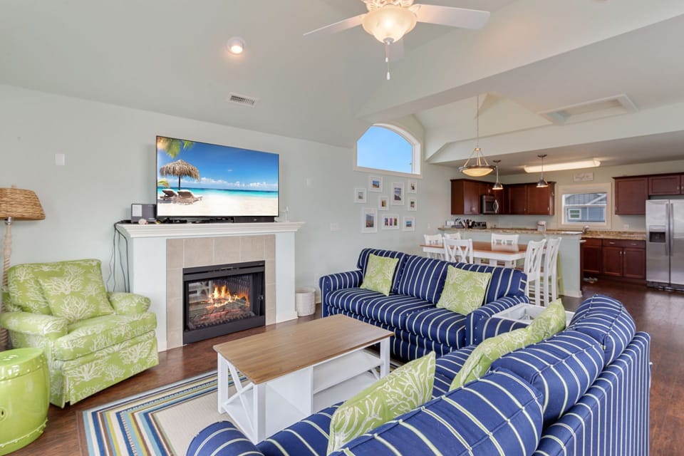 Bright and Colorful Living Area with Electric Fireplace and a Flat Screen TV!