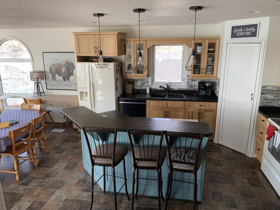 kitchen, main floor open concept kitchen, living room and den