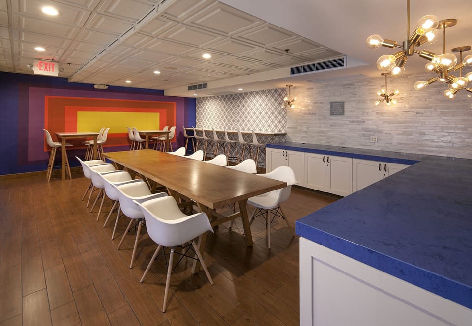 Host a shared meal at the long table and bar seating.