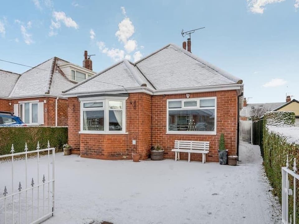 Front of property, parking for up to 3 cars, gates and ramp access into property