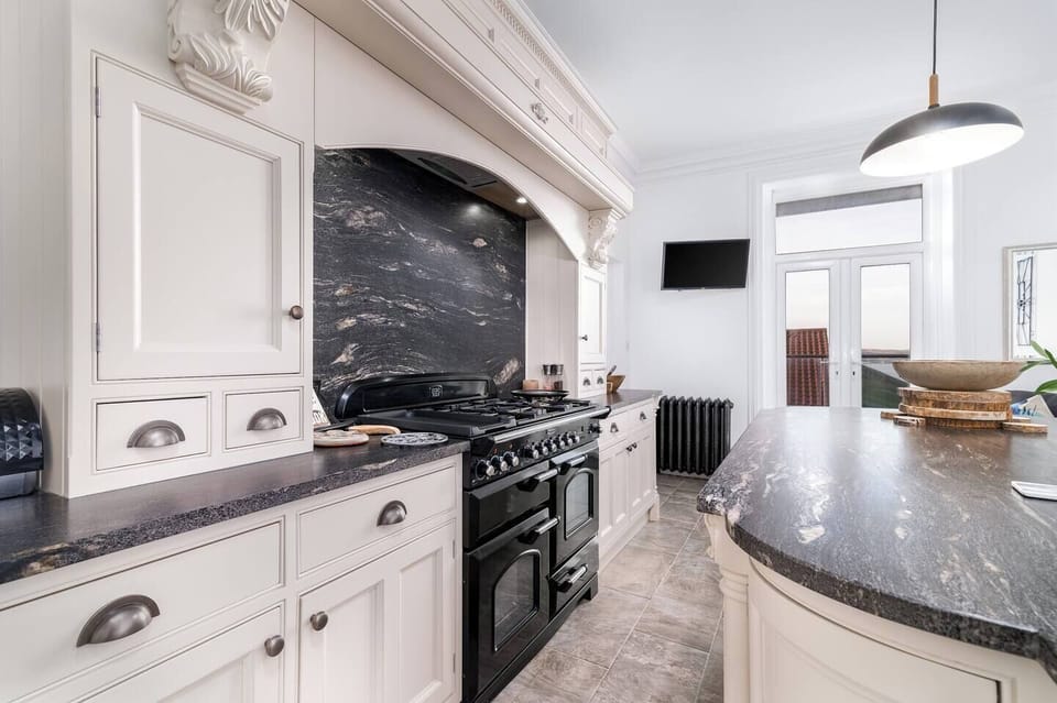 Kitchen with large gas cooker and hot for cooking family meals.