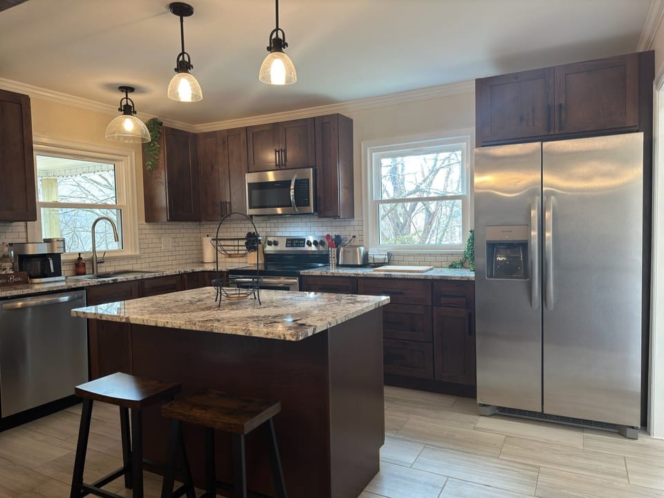 Lovely, remodeled kitchen with new granite countertops and custom cabinets!