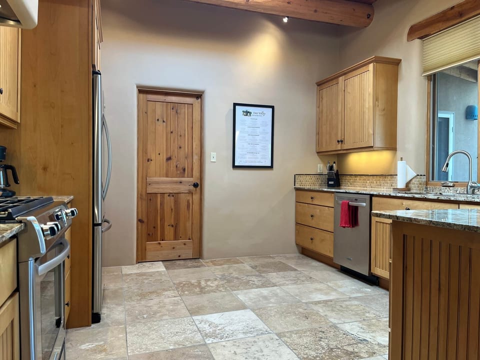 Access to full laundry room and garage through kitchen