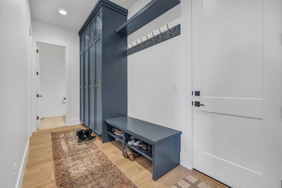 Mudroom off the 2 car garage with 1/2 bath and full laundry room on the left 