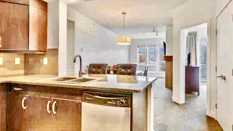 Bright and functional the open concept kitchen has bar seating for two 