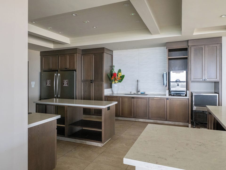 Beachfront pavilion features kitchen, ice machine, and ample shaded seating.