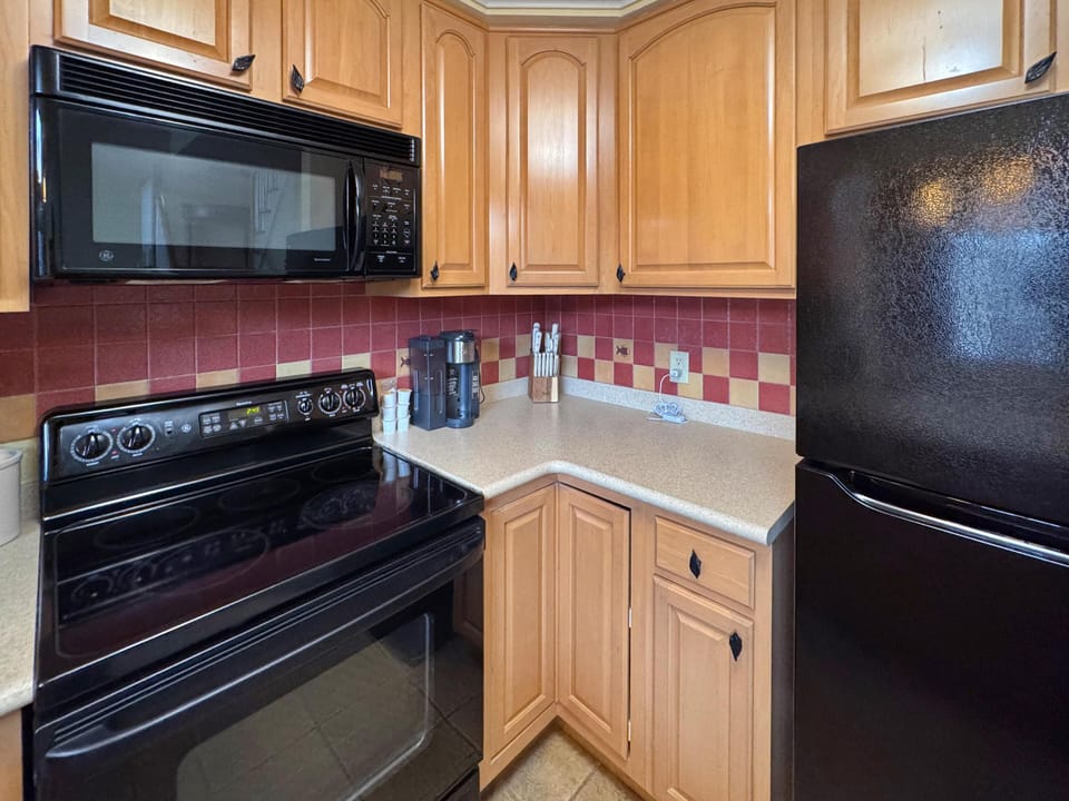Cozy kitchen with modern appliances and vibrant backsplash