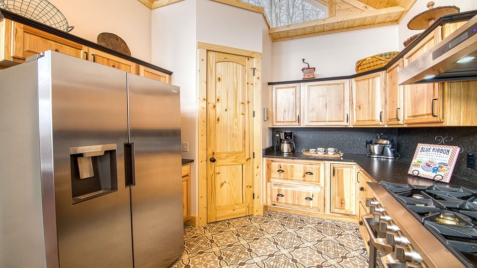 The kitchen has plenty of cupboard/pantry space.