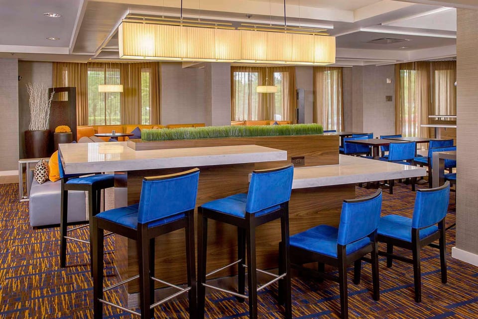 Sip, snack, and socialize around the sleek communal high-top.
