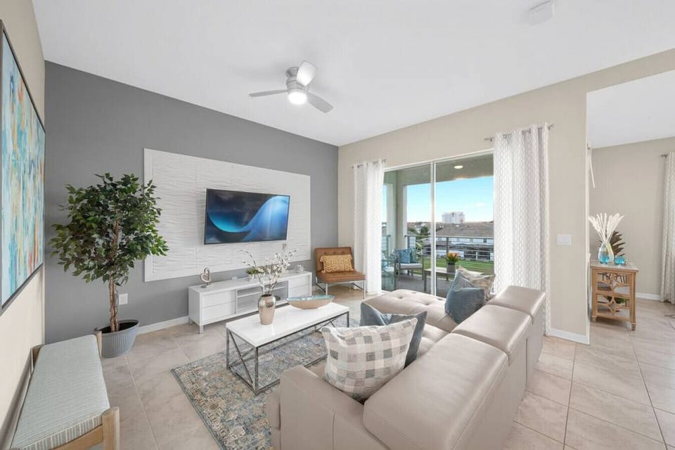 Modern open concept of living room, dining room and kitchen with island!LAKE VIEW & 55` Smart TV!#Disney #Parks #kingdom #springs #StoreyLake #Apartment #Vacation #Rental #waterpark #Kissimmee #Orlando #universal #citywalk
