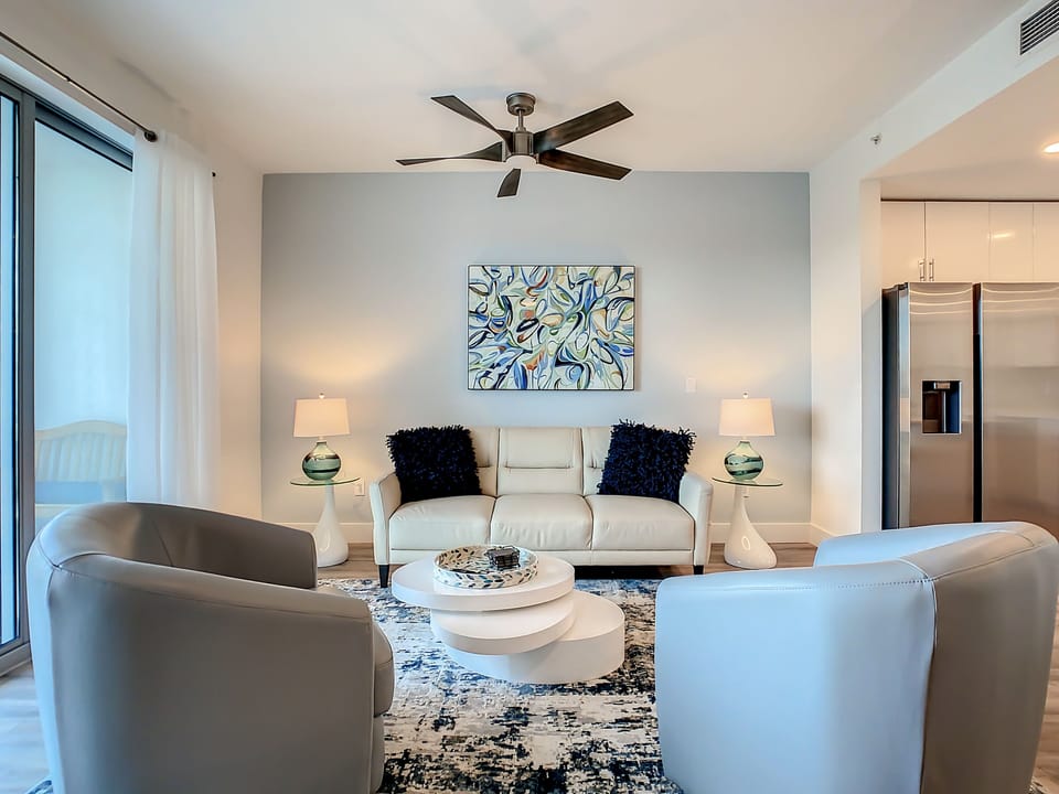Great room with leather couch and leather club chairs 