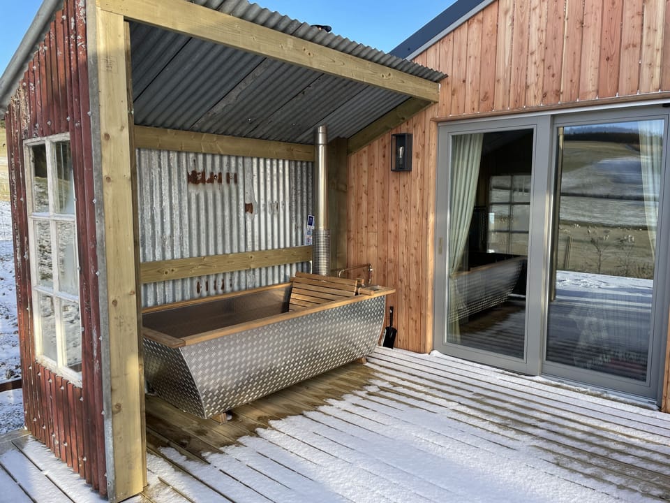 Hikki Wood-Fired Hot Tub, beside doors to Guest Bedroom