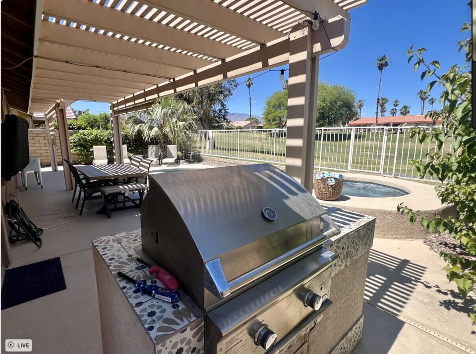 Enjoy your day grilling in the shaded patio