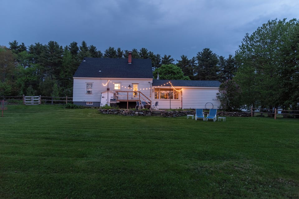 🌌 Spacious yard with string lights and cozy night vibes! ✨🏡  
