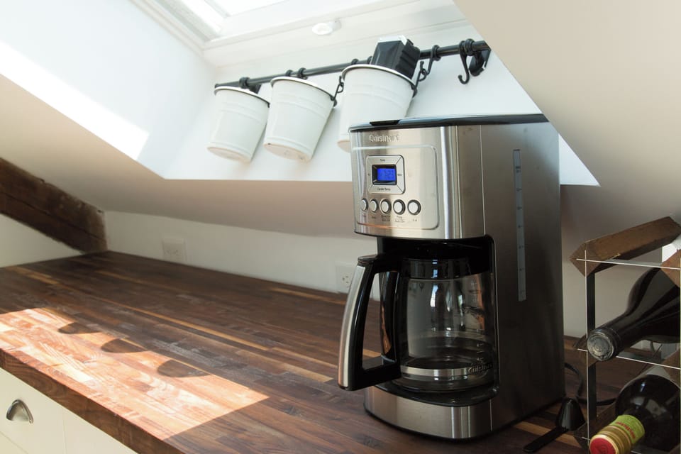 Kitchen Delight: Brew your morning coffee under sunlit skylights, perfect for culinary adventures!