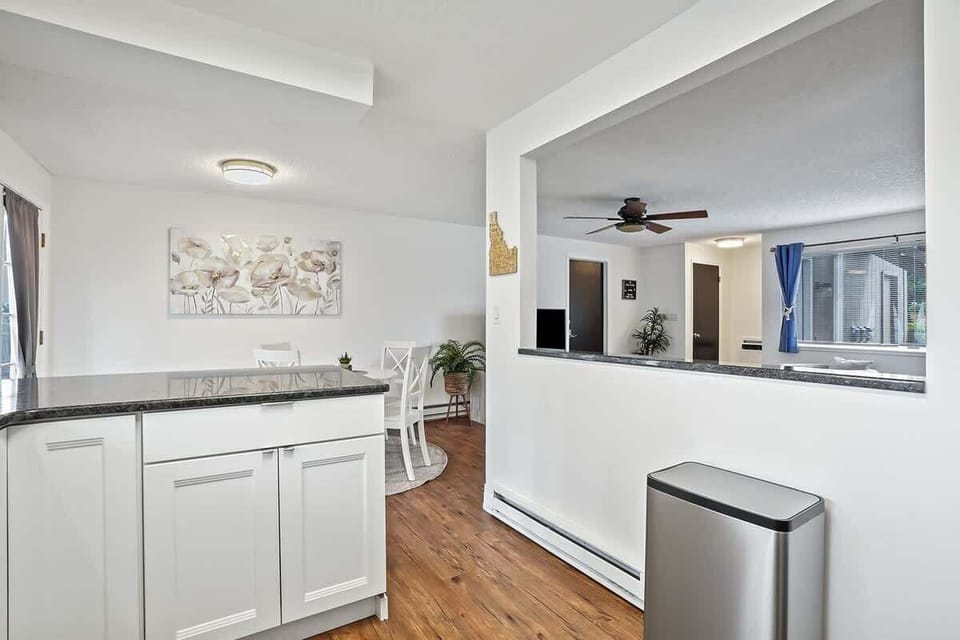 Kitchen opening to dining and living area