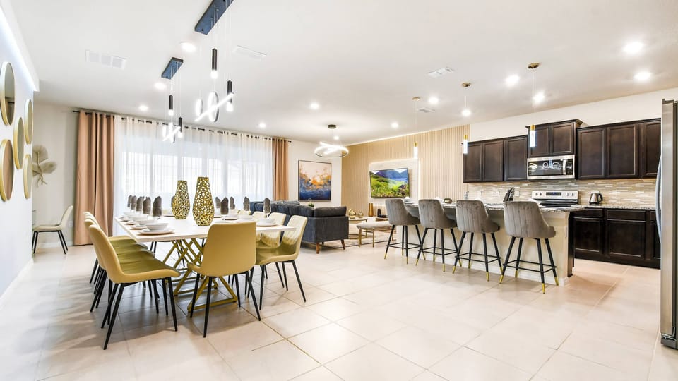 Elegant open-concept space with gourmet kitchen, spacious dining, and cozy lounge

