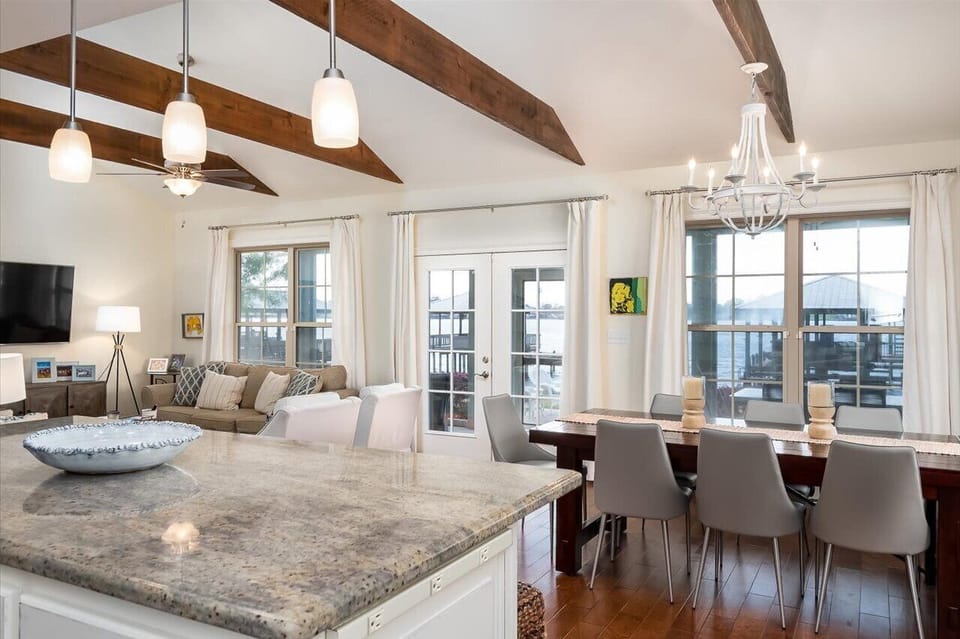 Spacious kitchen, dining and living area with sweeping lake views