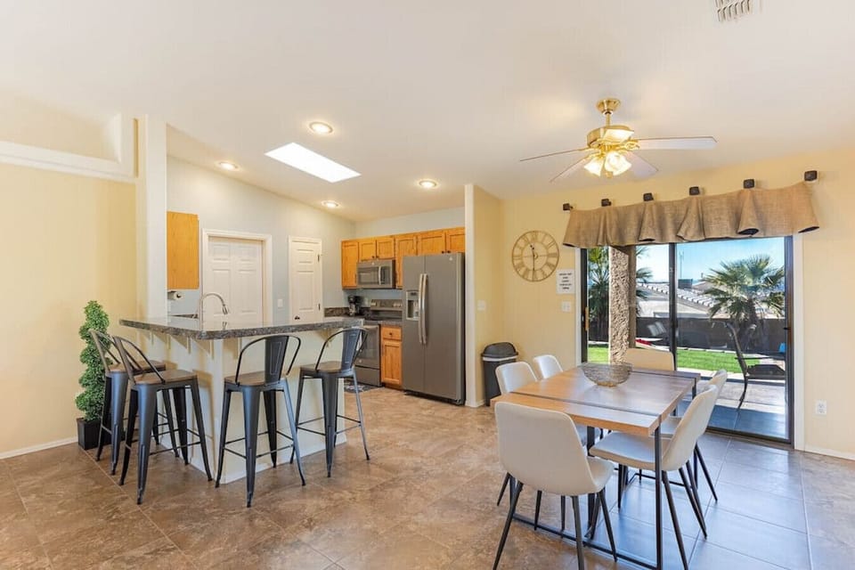 Six (6) seater dining table with lake/patio views out the window