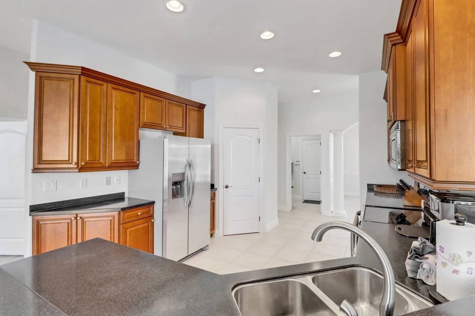 The kitchen has abundant cabinet and counter space, newer appliances, a full pantry, cookware, dinnerware and many kitchen tools included.