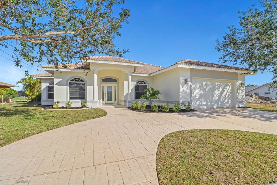 This classic Florida pool home on a freshwater canal is centrally located in Cape Coral, allowing you to easily enjoy the best of SWFL.