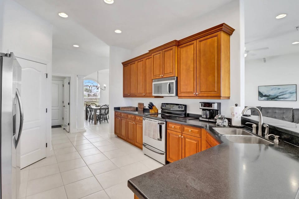 The spacious kitchen flows easily between the dining room and the living area, making it the heart of the home.