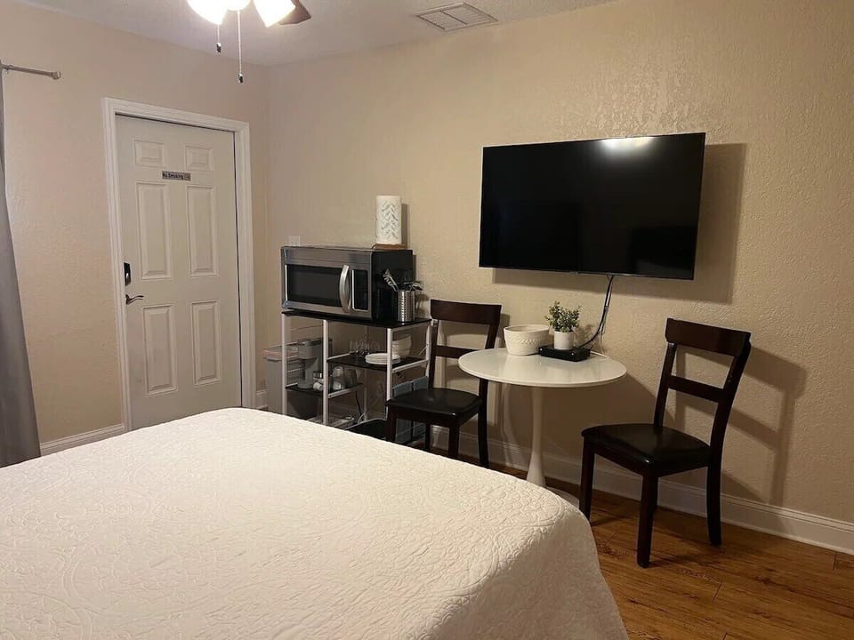 Dining table with 2 chairs, kitchenette that comes with microwave, burner
