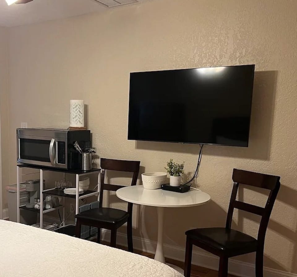 Dining table with 2 chairs, kitchenette that comes with microwave, burner