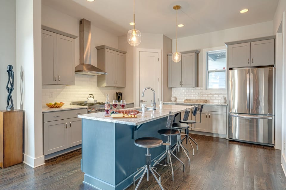 Fully equipped kitchen stocked with your basic cooking essentials complete with breakfast bar seating.