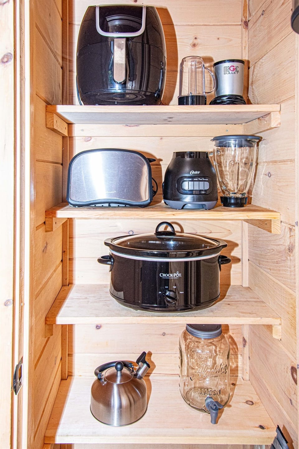 Appliances include: air fryer, magic bullet mixer, toaster, blender, crock pot, tea kettle, and hand mixer.