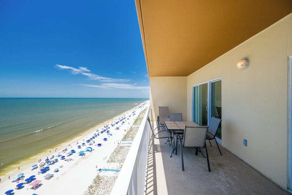 Enjoy stunning views from the balcony, complete with comfortable seating and a stunning shoreline below