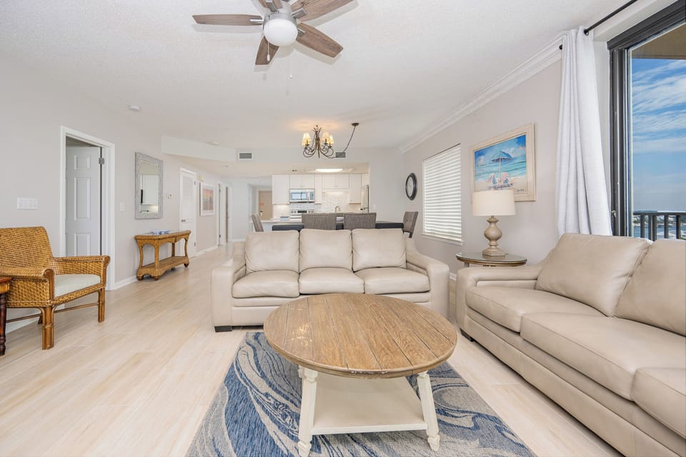 Unwind in the spacious living area, featuring comfortable seating and a view that invites relaxation and enjoyment