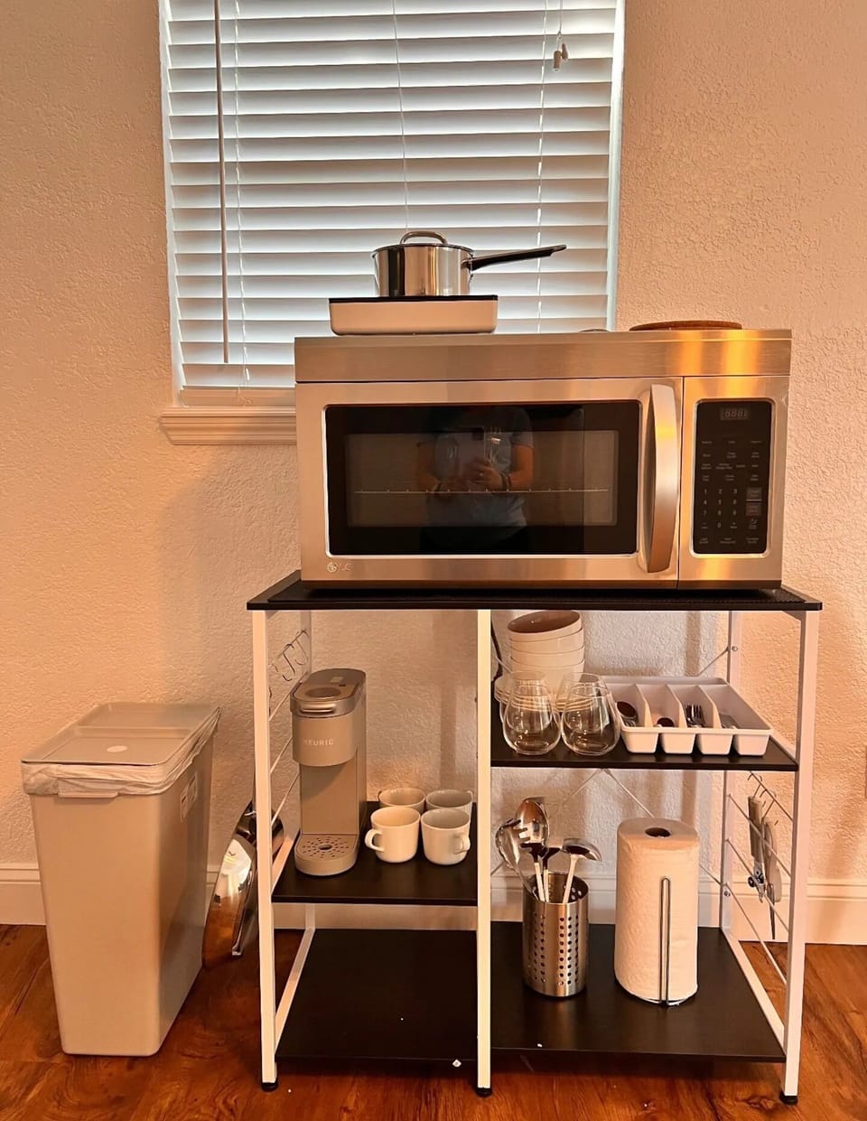 Kitchenette that comes with microwave, burner, and Keurig Coffee maker.